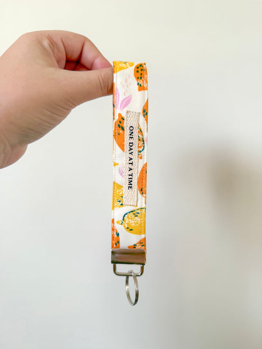 One day at a time wristlet keychain